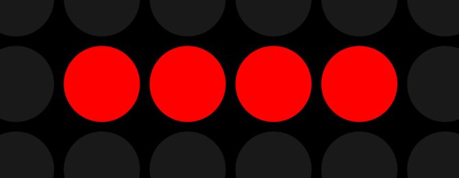 4 red dots on a black background
